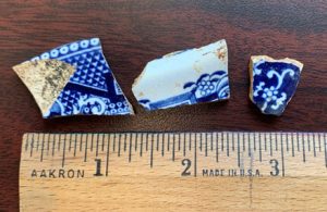 Three sherds with decorative patterns. 
