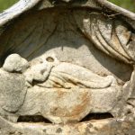 RECLINING CHILD FIGURE: Common from about 1890 through 1920, reflective of the Victorian conceit equating death with sleep.