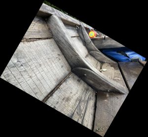 Batteaux are rugged craft designed for cargo and rocky rapids. Rough-sawn oak planks are seen here joined to the frames of the boat and held together with traditional-style cut nails. An ell-shaped pine sheer strake, seen at the top of the picture, runs continually from fore to aft to give the vessel additional strength.