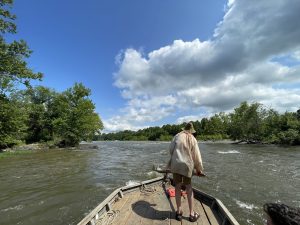 Our headman, Kevin, picks out a path through a shoal area. The sweep oar can point the bow and the stern oar helps line up the boat to follow the path. The job can go from very boring to very exciting quite fast!