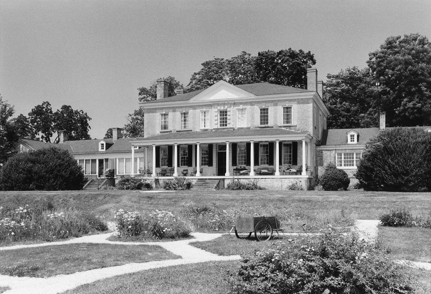 Rear (south) elevation and gardens. Photo credit: Calder Loth/DHR, 1992