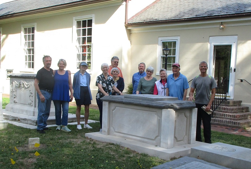 Members of the Grace Church Cemetery Committee with the recently restored monument for William Nelson 2026